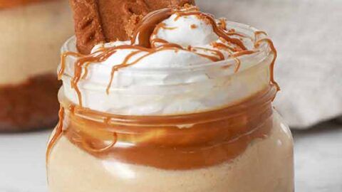 two desserts with whipped cream and caramel on top, one topped with chocolate