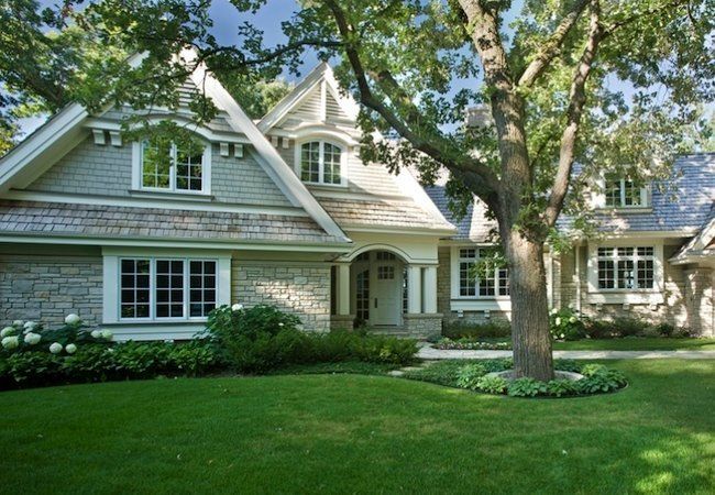 a large house with lots of trees in front of it