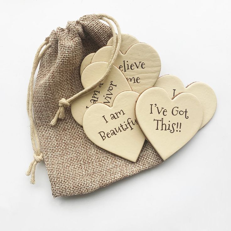 three heart shaped wooden tags that say i've got beautiful