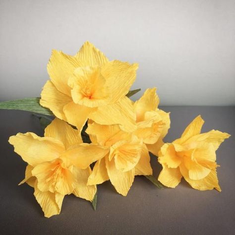 some yellow flowers are sitting on a table