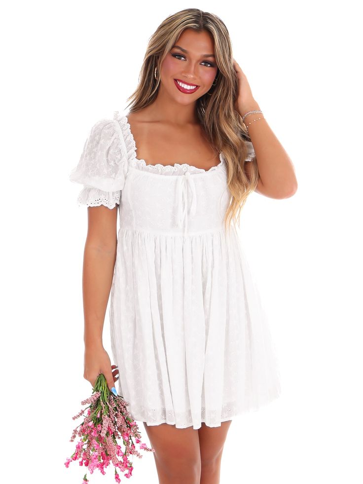 Embark on a new fashion journey with our New Adventure Mini Dress! This off white dress boasts embroidered eyelet detail, shirring front tie, and a back zip closure for easy dressing. Its lined construction and short sleeves with elastic and ruffled cuffs add a touch of comfort to its stylish design. Let this dress take you on a playful and unique style adventure! White Country Dress, Zack Bryan, Country Dress, Off White Dress, Kacey Musgraves, Country Dresses, Off White Dresses, New Adventure, Easy Dressing