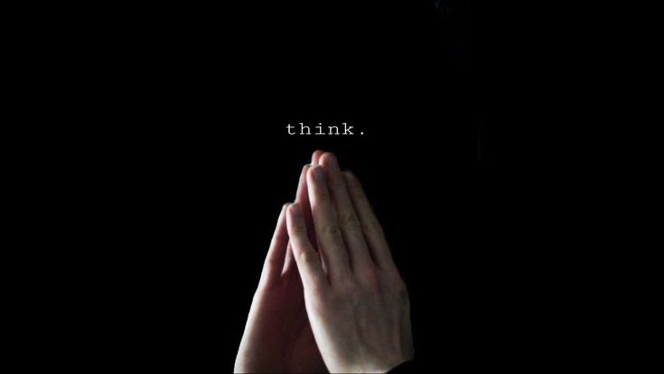 someone holding their hands together with the words think above them in white letters on a black background