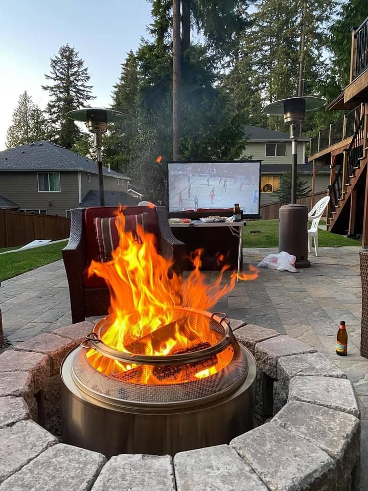 a fire pit in the middle of a patio