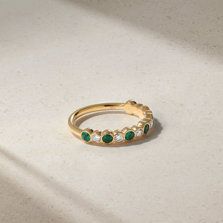 18kt Yellow Gold Elegant Eternity Band For May Birthstone, Elegant Emerald Half Eternity Ring, Elegant Round Emerald Ring With Half Eternity Setting, Elegant Round Emerald Ring With Half Eternity Band, Stackable Emerald Ring With Diamonds, Luxury Emerald Half Eternity Diamond Ring, Stackable Diamond Emerald Ring With Round Shape, Fine Jewelry Emerald Ring With Round Cut Half Eternity, Green Diamond Half Eternity Ring