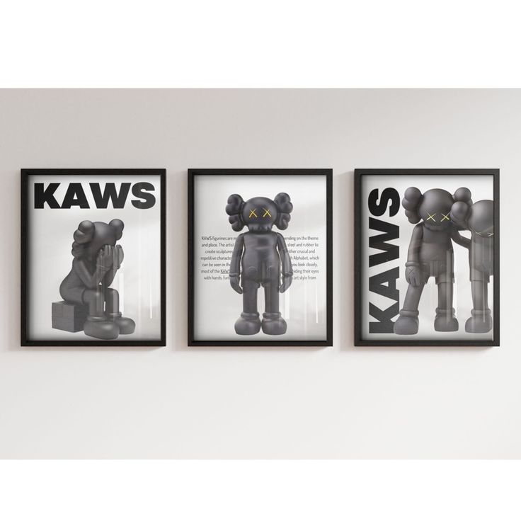 three black and white posters on the wall in a room with an image of two bears