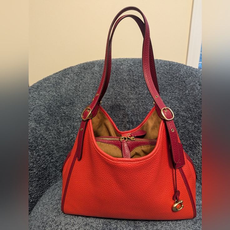 Coach Lori Shoulderbag N Brass / Red Orange Multi Colorblock. Style # C6627. Gently Used, In Fantastic Condition. No Odors, No Stains, No Marks. Minor Corner Wear. Please See Photos For Usage. More Photos Provided Upon Request. Purse Always Used/Kept In A Smoke-Free Environment. Soft Pebble Leather Inside Snap Pocket Center Zip Compartment Magnetic Snap Closure, Fabric Lining Adjustable Handles With 11" Drop Outside Zip Pocket Four Protective Feet At Base 12 1/4" (L) X 10 1/4" (H) X 6" (W) Offer Red Hobo Bag With Leather Handles For Everyday Use, Red Hobo Bag With Leather Handles For Errands, Luxury Red Shoulder Bag For Errands, Red Satchel With Leather Handles For Errands, Designer Red Satchel For Everyday, Red Satchel With Leather Handles For Everyday Use, Everyday Red Satchel With Leather Handles, Red Top Handle Hobo Bag For Everyday, Red Leather Satchel For Errands