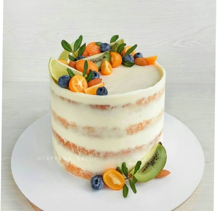 there is a cake with fruit on it