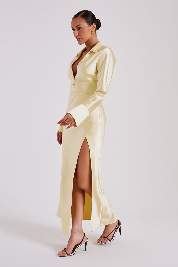 More than a statement, it’s a declaration.This is a long-sleeved maxi dress with a deep collared neckline and centre front button detail. The sleeves end in lined, flared cuffs and the skirt ends in a clean-cut hem with a centre side hem split. The waist is lightly cinched to create a loose hourglass silhouette, further complemented by the soft draped MESHKI blend fabrication. Elegant in its simplicity, this dress is the perfect choice for quick glam. Hourglass Silhouette, Long Sleeve Maxi, Clean Cut, Long Sleeve Maxi Dress, Button Detail, Latest Fashion Trends, Nice Dresses, Split, Butter