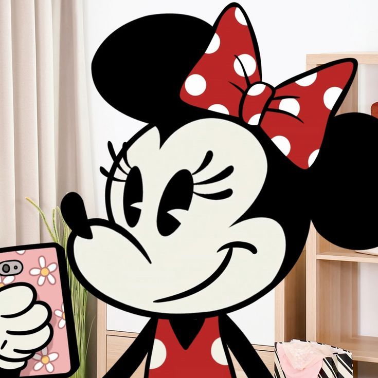 a cartoon minnie mouse holding a cell phone