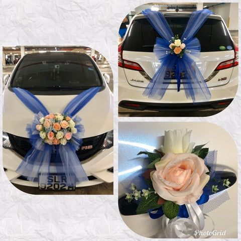 the car is decorated with flowers and ribbons