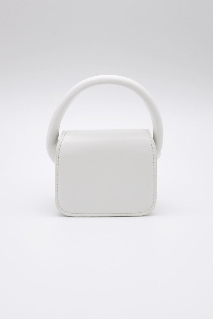 Bethany Micro Mini Bag This product has been hand-picked by Storets' stylists. White Tote Baguette Bag For Shopping, White Baguette Tote Bag For Shopping, White Square Bag With Adjustable Strap, White Double Handle Baguette Bag For Errands, Modern White Box Bag With Handles, Modern White Tote Baguette Bag, Modern White Top Handle Baguette Bag, White Baguette Tote Bag For Errands, Modern White Bag With Round Handle