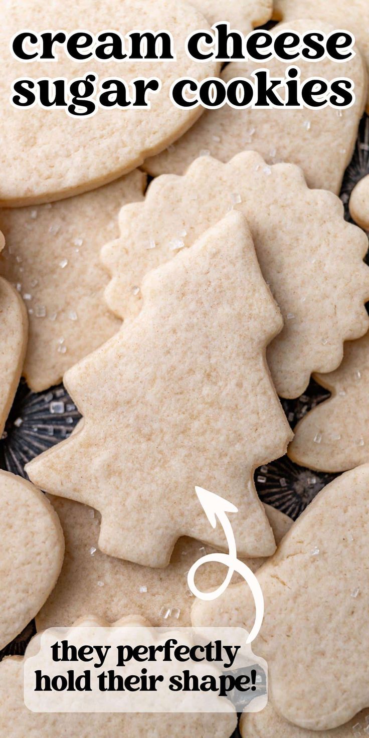 there are cookies that have been cut in half to look like christmas trees and the words, cream cheese sugar cookies they perfectly hold their shape