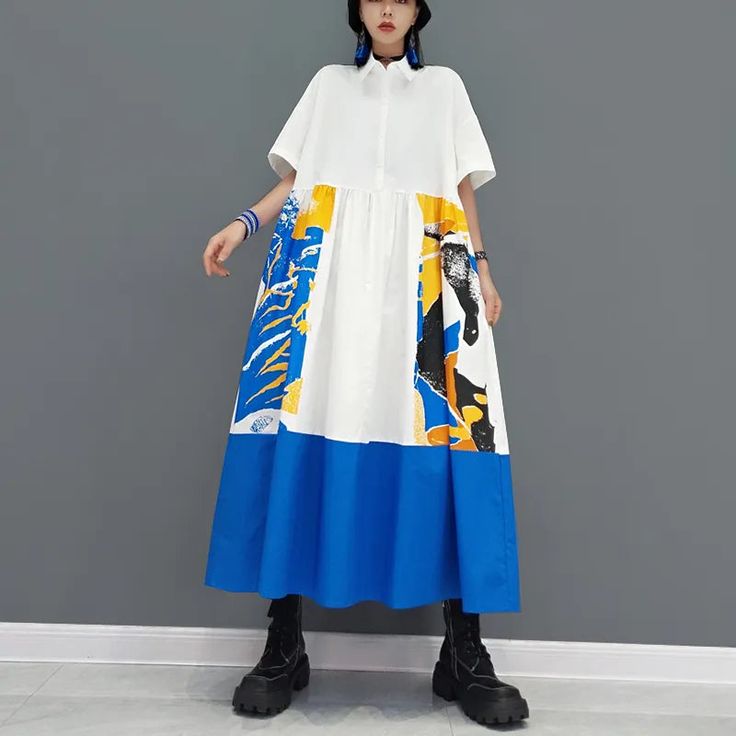 Dare to stand out in this vibrant shirt dress!! Flaunt your flair with colorful pockets and a playful, abstract design. This long, casual dress delivers comfort with an artsy twist; perfect for those who craft their own style. Casual Cotton Midi Dress With Patchwork, Casual Short Sleeve Midi Dress With Patchwork, Casual Midi Dress With Graphic Print, Casual Patchwork Midi Dress With Short Sleeves, Casual Abstract Print Dress With Short Sleeves, Casual Summer Shirt Dress With Patchwork, Casual Patchwork Shirt Dress For Summer, Casual Abstract Print Midi Dress For Spring, Casual Patchwork Shirt Dress For Spring