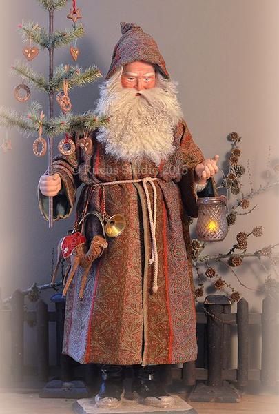 a christmas card with an image of santa claus holding a lit candle and ornaments in his hand