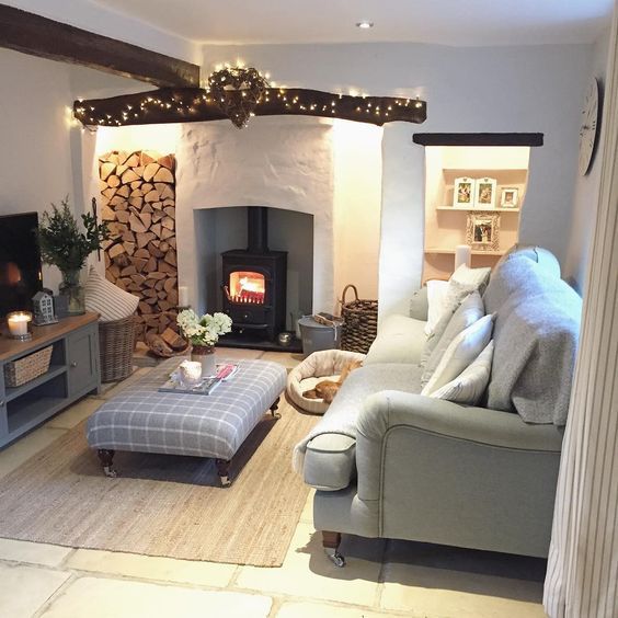 a living room filled with furniture and a fire place