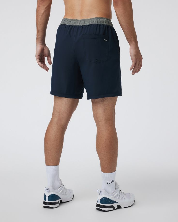 One short for every sport, the Kore Shorts have a classic athletic fit, falling just above the knee with an anywhere and everywhere versatility. Go commando in confidence with the breathable, boxer-brief liner. | Vuori Kore Shorts | Ink | XXL Vuori makes premium performance apparel inspired by the active Coastal California lifestyle; an integration of fitness, surf, sport, and art. Breaking down the boundaries of traditional activewear, we are a new perspective on performance apparel. Recycled Polyester Athletic Shorts With Elastic Waistband For Sports, Casual 5-inch Inseam Athletic Shorts For Training, Sporty Athletic Shorts With Comfort Waistband For Workout, Relaxed Fit Activewear With Short Inseam For Sports, Sporty Compressive Athletic Shorts With Elastic Waistband, Sporty Navy Bottoms For Outdoor Activities, Sporty Navy Bottoms For Outdoor, Casual Compressive Athletic Shorts Sweat Resistant, Casual Compressive Sweat-resistant Athletic Shorts