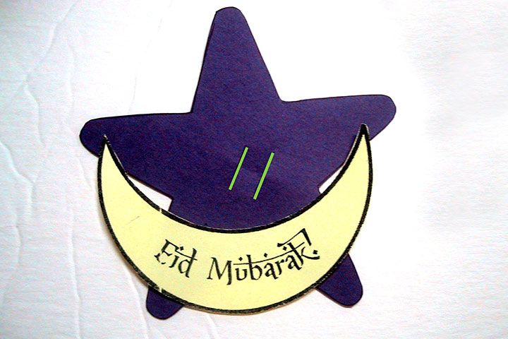 a paper cut out of a purple witch hat with the words ed milbra written on it