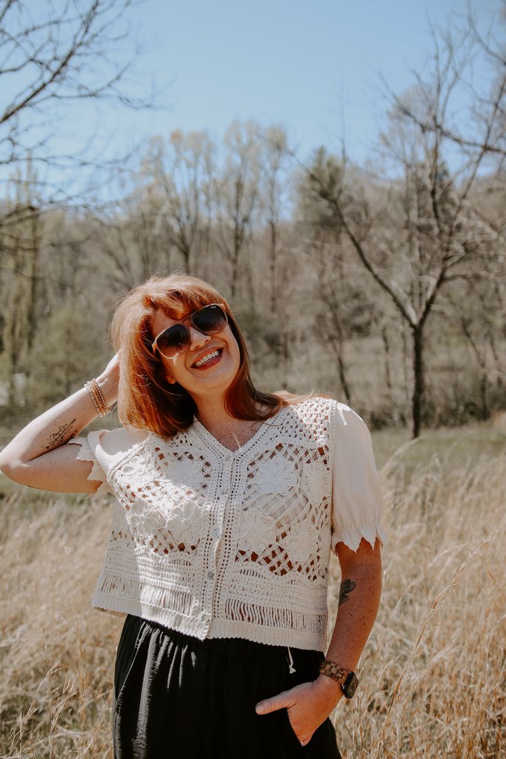 Be the life of the party in the Belize Top! This playful mesh top features delicate floral crochet details and a v-neck button down with contrast scallop elastic sleeves. Its vintage cream color and crop length add a unique touch. (Hot tip: pair with high-waisted jeans for a flirty and fun look!) Trendy V-neck Crochet Top For Spring, Summer Cropped Tops With Lace Collar, Cropped Tops With Lace Collar For Summer, Cropped Lace Top With Patchwork For Spring, Cropped Lace Patchwork Top For Spring, Cropped Lace Top With Lace Patchwork For Spring, Feminine Crochet Top With Lace Patchwork For Spring, Feminine Lace Patchwork Crochet Top For Spring, Cropped Lace Blouse With Lace Trim For Spring