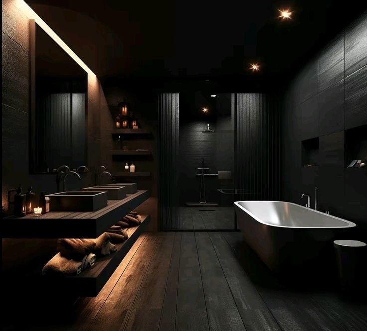 a dark bathroom with two sinks and a bathtub in the middle is lit by lights