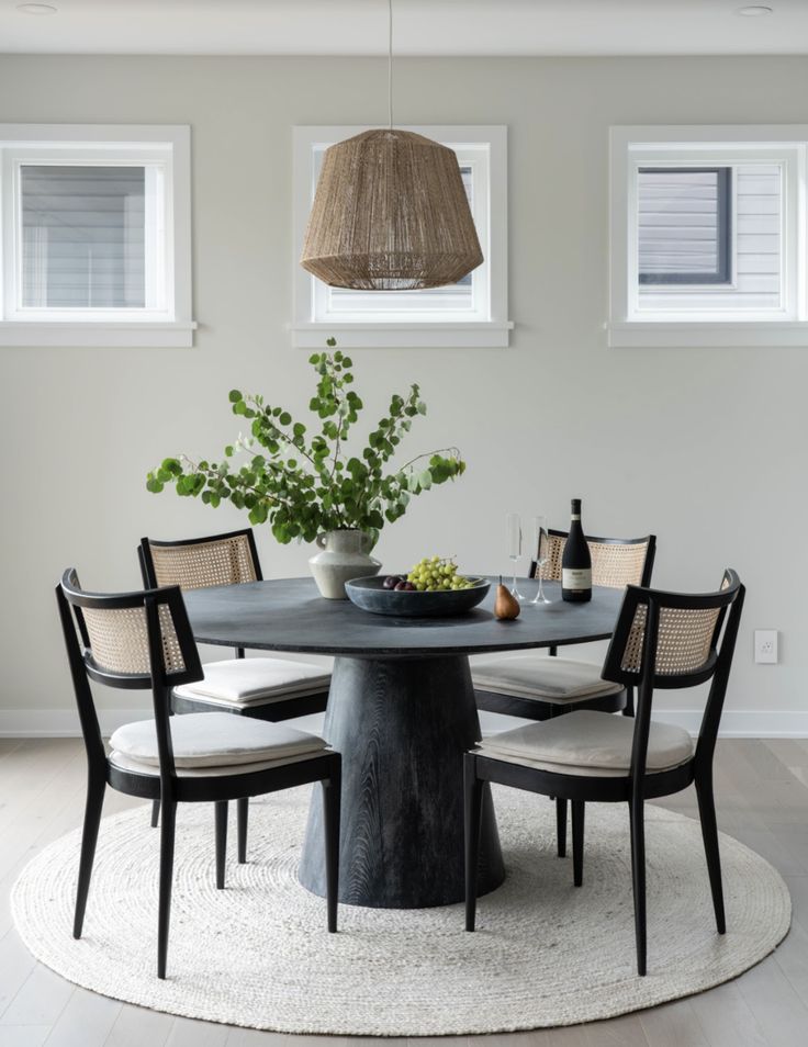 a dining room table with chairs around it