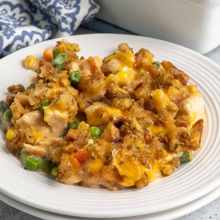 a close up of a plate of food on a table with a container in the background