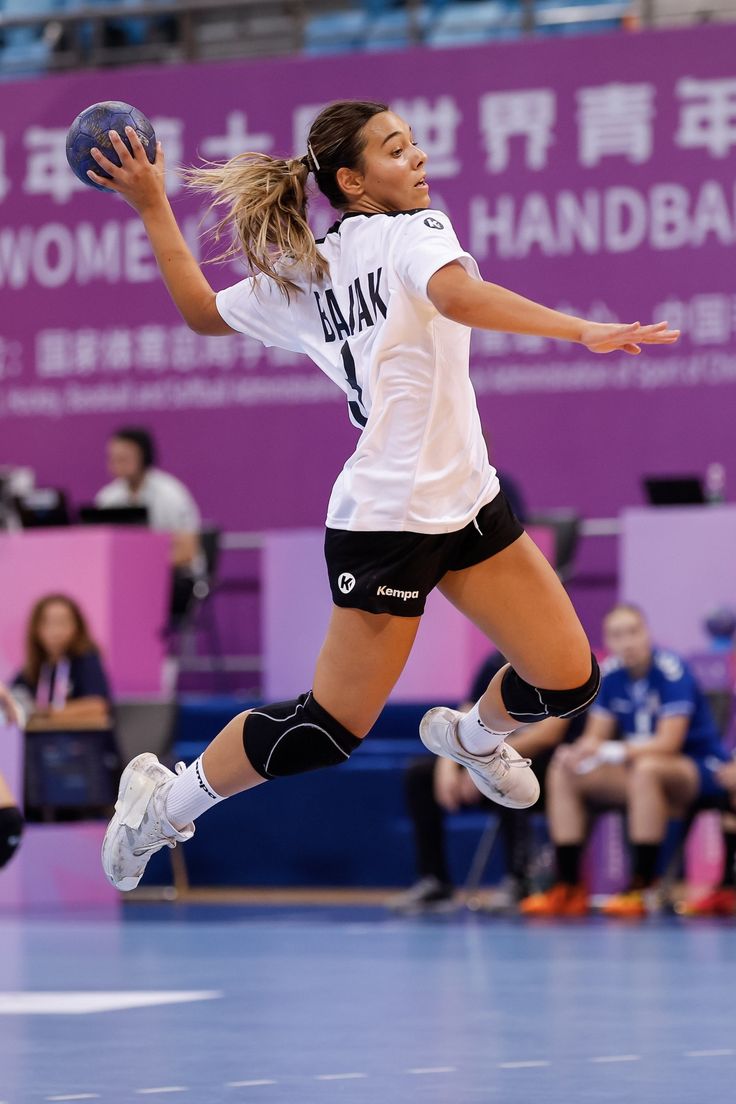 a female volleyball player in action on the court