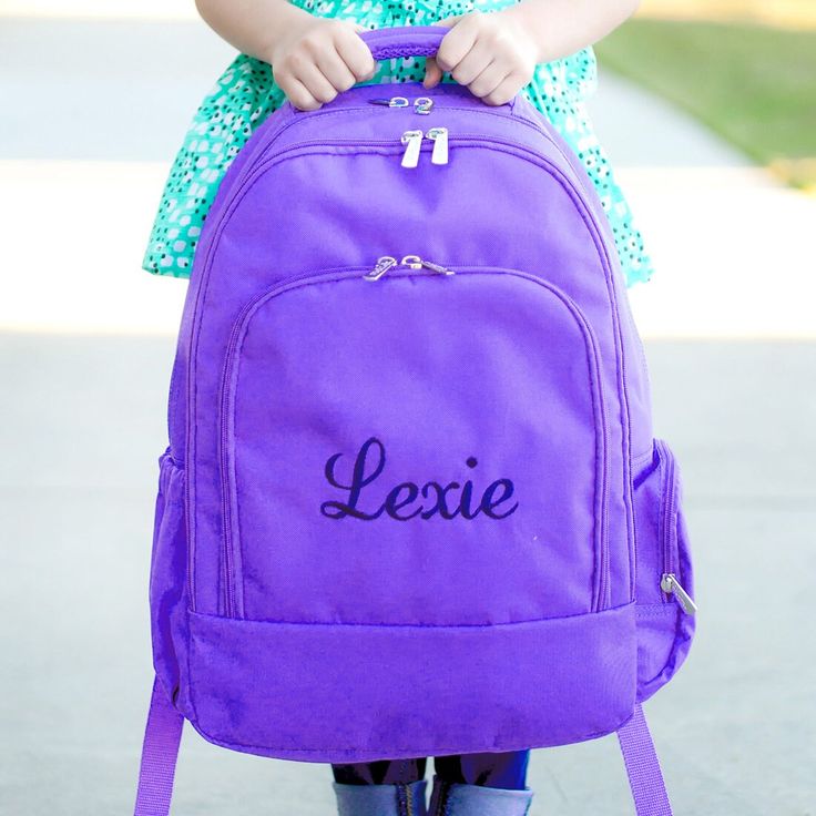 With kid-approved bright colors and fun designs, send your child back to school with personalized school supplies! Our multi-color lunchboxes and backpacks for girls and boys are a hit! Add his or her name, nickname or initials to make it even more special! The sturdy and durable backpack: 12" L x 5" W x 17" H Polyester Adjustable Comfort Fit Shoulder Straps Padded Tablet/Laptop Compartment Inside Lining Reinforced Design 3 Main Compartments with Multiple Pockets Including an Exterior Elastic Pocket Zipper Closure Playful designs and functional school essentials combined with stylish personalization equals a win for moms and dads!  the item!    For detailed FAQ's for personalization and terms please see https://www.dramadecor.com/pages/etsy-terms-conditions For font options please see the Middle School Backpack, Mint Backpack, Backpack Purple, Navy Backpack, Water Resistant Backpack, Tote Bags For School, Embroidered Backpack, Girls Backpack, Monogram Backpack