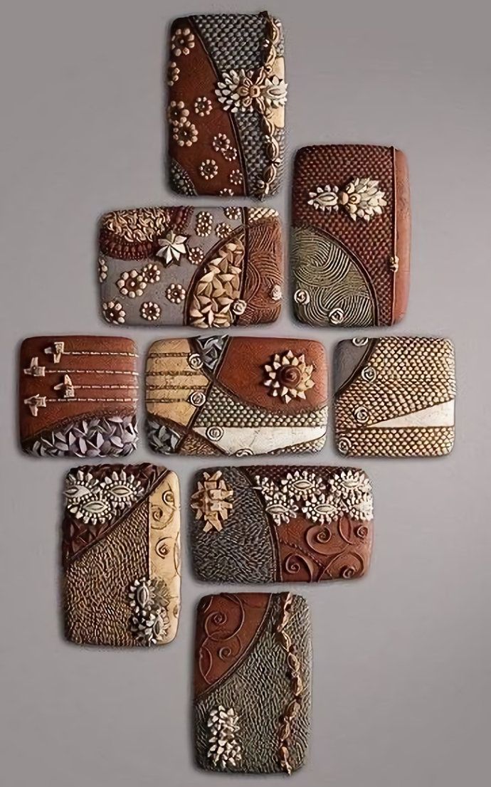 a group of different pieces of art made out of wood and metal with flowers on them