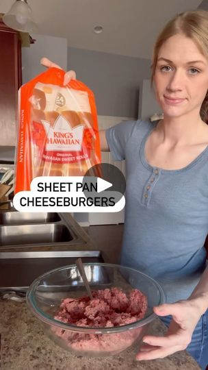 a woman holding a bag of cheeseburgers next to a bowl of ground beef