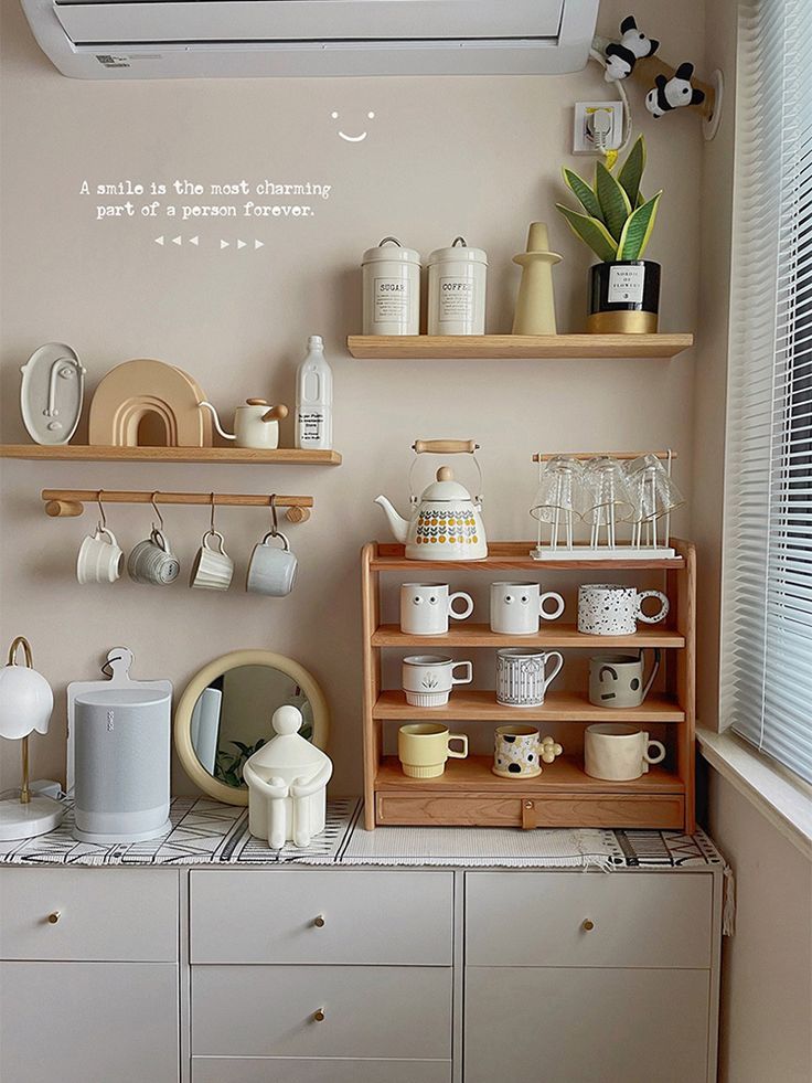 the kitchen is clean and ready to be used for tea or coffee making, as well as other things that are on the shelves