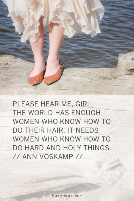 a woman standing on top of a pier next to the ocean with her feet in the water