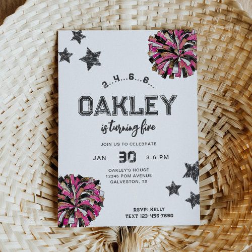 a white and pink birthday party card sitting on top of a wicker basket