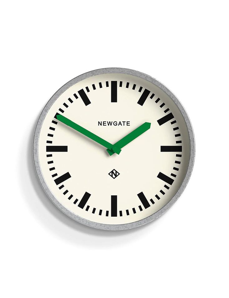 a white clock with green hands and numbers on the face is against a white background