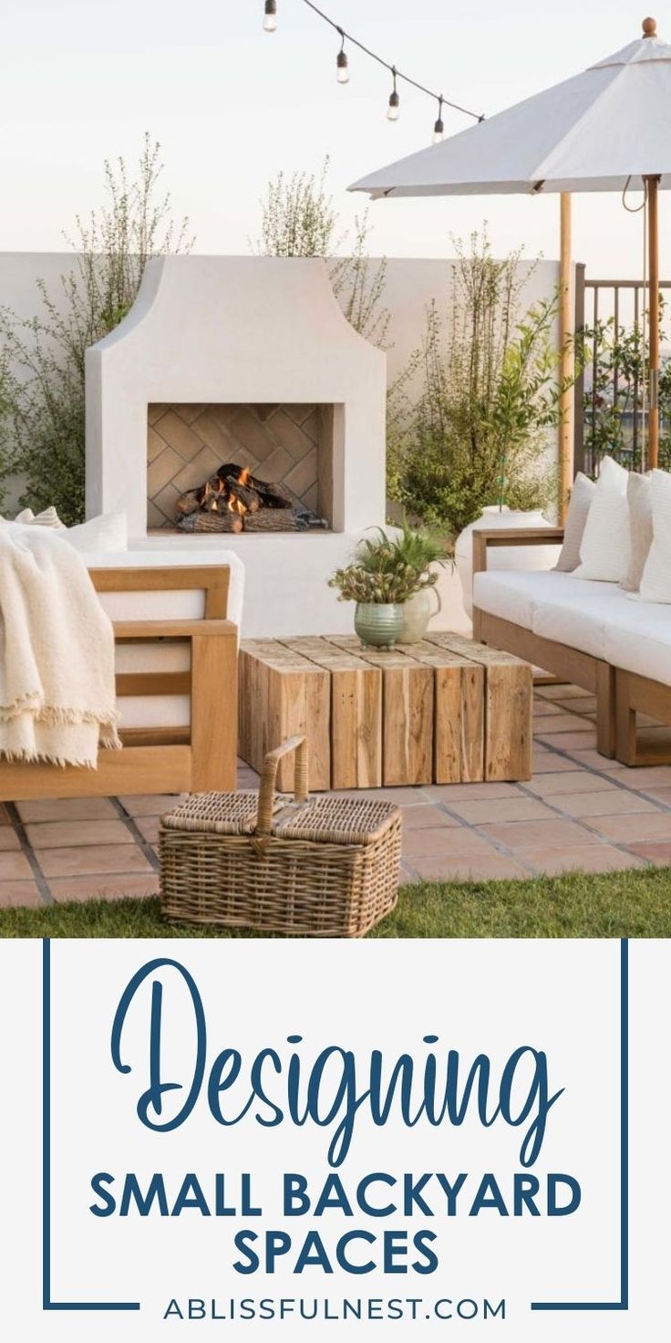 an outdoor living area with white couches and wooden tables in front of the fire place