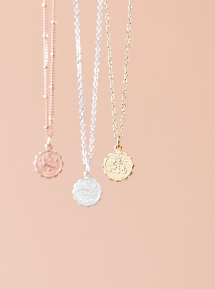 Our dainty zodiac coin necklace features a round scalloped pendant with a zodiac sign on it. Made in 14k Gold Plated, Silver Plated or Rose Gold Plated. -------------------------------- DETAILS GOLD VERSION: • PENDANT is Gold Plated over Brass measuring 12mm • CHAIN is 14k Gold Plated or Gold Filled • CLASP is 14k Gold Filled ROSE GOLD VERSION: • PENDANT Rose Gold Plated over Brass measuring 12mm• CHAIN is 14k Rose Gold Plated or Rose Gold Filled • CLASP is 14k Rose Gold Filled SILVER VERSION: • Dainty Zodiac Sign Round Necklace, Dainty Zodiac Sign Necklace, Zodiac Sign Round Pendant Jewelry, Dainty Round Disc Coin Pendant Jewelry, Dainty Jewelry With Round Disc Coin Pendant, Dainty Zodiac Sign Pendant Necklace, Minimalist Zodiac Sign Round Pendant Jewelry, Minimalist Round Zodiac Sign Necklace, Minimalist Zodiac Sign Jewelry