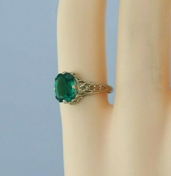 "14K White Gold Art Deco Filigree Green Stone Ring, 6x8mm center stone, 3/8\" across, pierced decoration, Ring size 4, 1.7 grams Stock # BB231R24 Most rings are sizable for a small fee. If the ring you are considering is the incorrect size contact us for a quote. This listing contains photographs of the actual item you will receive. Our items are in excellent condition with little or no signs of wear and many are one of a kind pre-owned estate finds. Please look closely at the pictures in this l Antique Emerald Jewelry For Formal Occasions, Antique May Birthstone Jewelry For Formal Occasions, Heirloom Pierced Jewelry For Formal Occasions, Heirloom Style Pierced Jewelry For Formal Occasions, Formal Heirloom Pierced Jewelry, Victorian Emerald Yellow Gold Jewelry, Victorian Emerald Jewelry In Yellow Gold, Victorian Yellow Gold Emerald Jewelry, Formal Emerald Jewelry With Filigree Detail