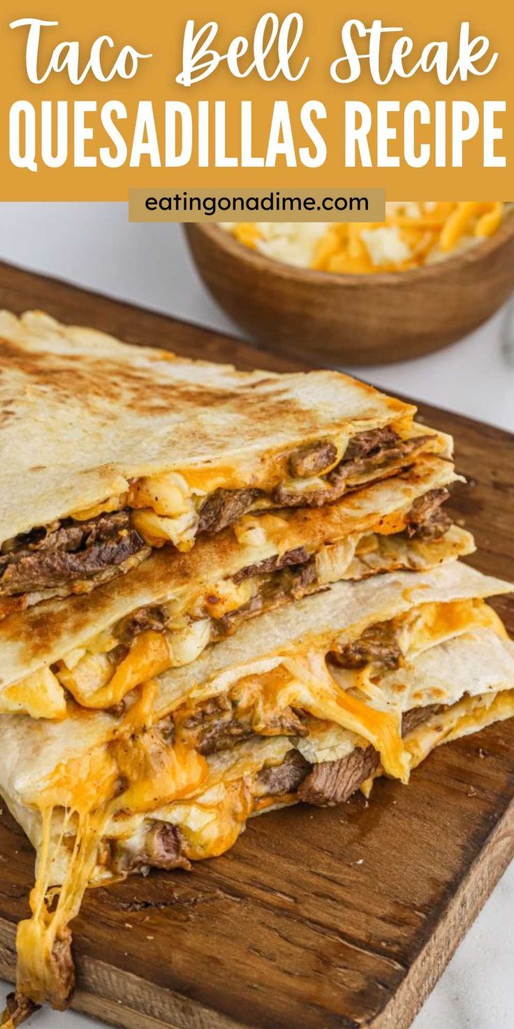 two quesadillas stacked on top of each other with cheese and meat in the middle