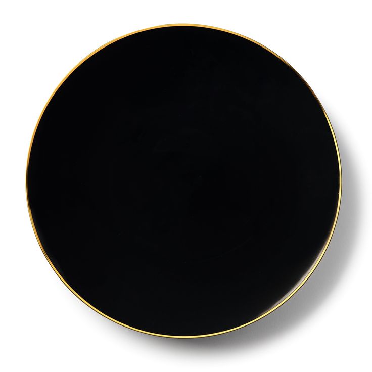 a black and gold plate on a white background