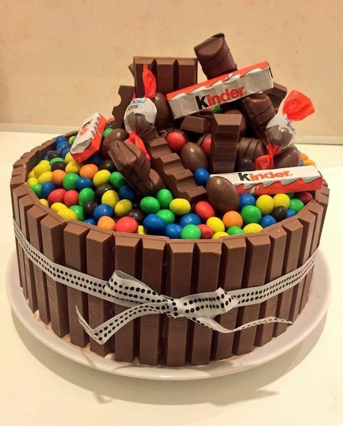 a chocolate cake with candy and candies on top