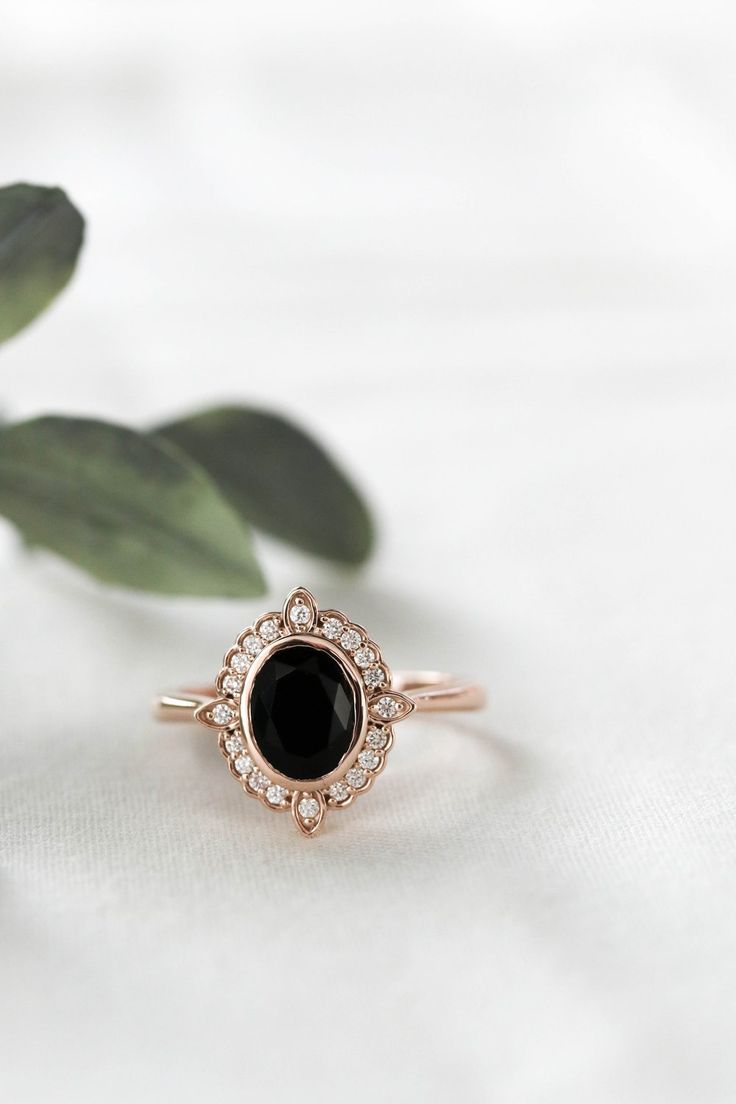 Atlas – Olive Avenue Jewelry Oval Halo Ring For Formal Occasions, Elegant Black Oval Ring, Timeless Oval Gemstone Halo Ring, Black Oval Jewelry With Center Stone, Timeless Oval Halo Ring With Gemstone, Black Oval Center Stone Jewelry, Classic Oval Halo Ring For Formal Occasions, Elegant Oval Halo Ring For Formal Occasions, Classic Halo Oval Cabochon Jewelry