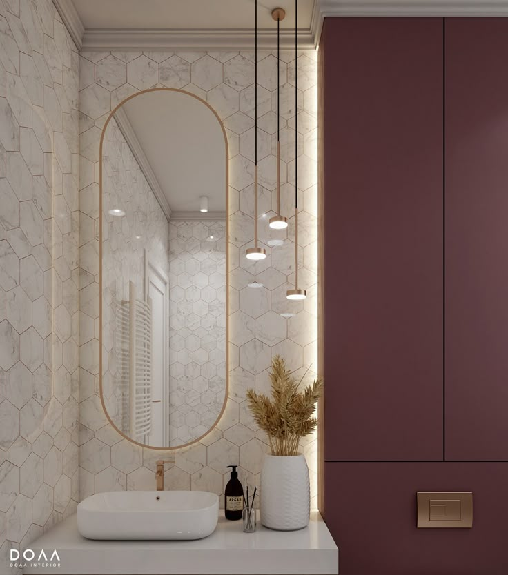 a bathroom with a sink, mirror and lights on the wall next to each other