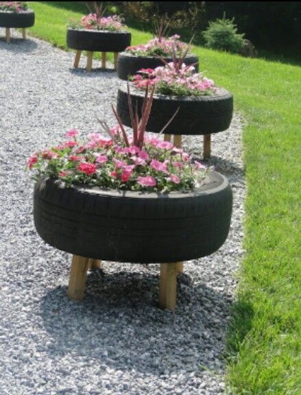 several flower pots made out of old tires