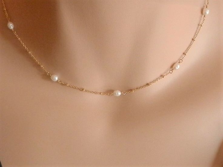 dainty gold choker dainty pearl choker gold rosary choker gold chain choker necklace gold satellite chain gold satellite necklace A beautiful pearl necklace on a satellite chain. Five freshwater pearls and a satellite chain make this necklace of a beautiful and elegant jewel! It can be made on a sterling silver or gold vermeil chain. Please, message me if you want a specific length that is not shown in the menu or if you are not sure of the length. Pearls may have imperfections as they are natur Dainty Pearl Necklace With Satellite Chain, Rose Gold Pearl Jewelry With Delicate Chain, Simple Gold Jewelry With Pearl Pendant, Delicate Pearl Necklace With Satellite Chain, Delicate 14k Gold Filled Choker, Delicate Gold Plated Jewelry With Satellite Chain, Gold Satellite Chain Jewelry For Wedding, Simple Pearl Jewelry With Delicate Chain, Dainty Gold Plated Pearl Necklace With Delicate Chain