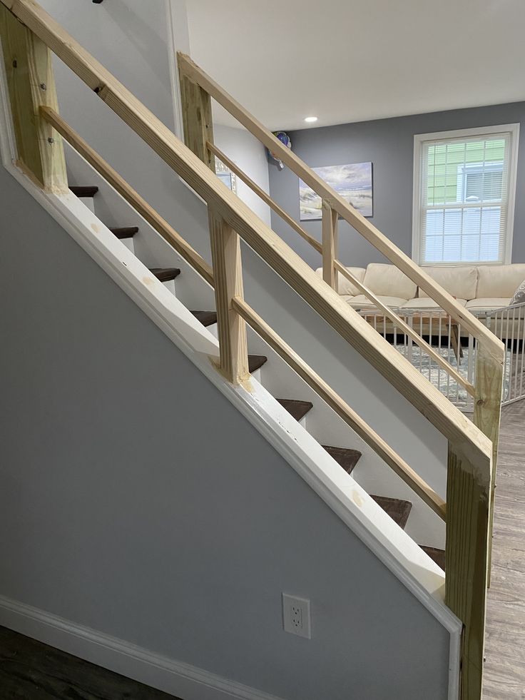 an empty room with stairs leading up to the second floor