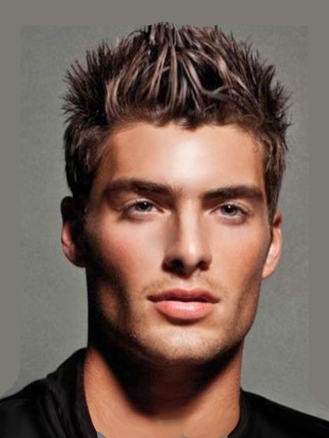 a close up of a person wearing a black shirt and short hair with spiked spikes on his head