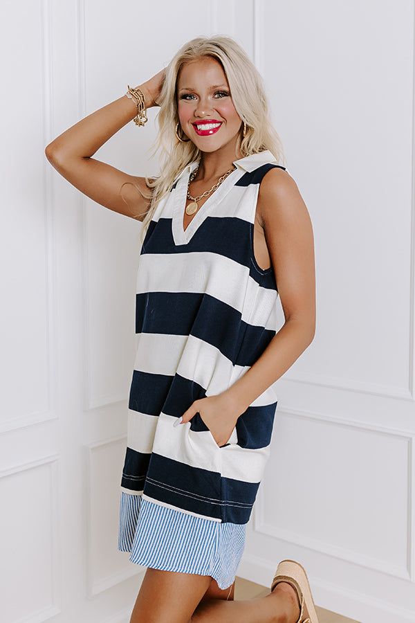 - Sail into the sunset in this nautical cutie! With a striped print and a sleeveless cut, it is a perfect piece of classic seaside style. You are sure to make a stylish splash with this charming dress. - Unlined striped material with blue and white hued accent trim at the bottom - A collared v-cut neckline - A sleeveless cut - Functional side pockets - A relaxed silhouette that ends in a straight mini dress length hemline Seaside Style, Accent Trim, Cut It, V Cut, V Cuts, The Sunset, Dress Length, Nautical, Blue And White