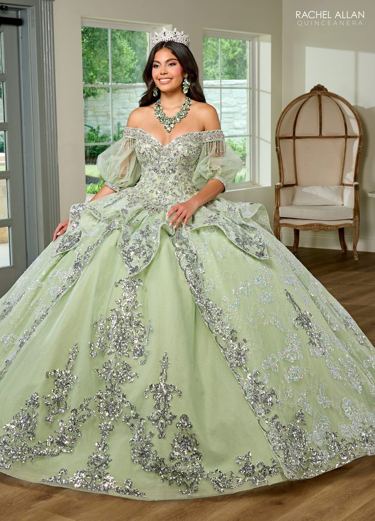 Light up the room in this beaded applique long off shoulder puff sleeve dress with A-line skirt by Rachel Allan RQ3128. Discover elegance and grace in this tulle ballgown. This romantic ballgown radiates with sophistication and is sure to leave a lasting impression. The off-the-shoulder neckline is hand beaded with applique and fringed detailing, adding a regal look to the entire silhouette. Detachable tulle sleeves provide a subtle vintage touch and a lace-up back offers the ultimate fit. As yo Detachable Tulle Sleeves, Dresses Organza, Beads Ornaments, Rachel Allen, Tulle Applique, Coral Ombre, Princesa Tiana, Red Quinceanera Dresses, Black Ball Gown