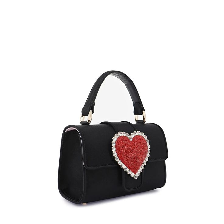 New this season, and one for the romantics, fall in love with the Amora Shoulder bag. Featuring a black leather outer with top handle, the newest design is adorned with a red crystal heart and outlined with clear crystal gems. Perfectly complement your date night fit or pick yours for the perfect gift for a loved one. Measurements: Width 18cm, Height 11.5cm, Depth 7cm Exterior: Textile, Leather, Interior: Textile, Leather HANDMADE IN: Spain Rich Clothes, Interior Textile, The Romantics, Lover Girl, Gothic Accessories, Bridal Event, Sophia Webster, Beaded Top, Red Crystals