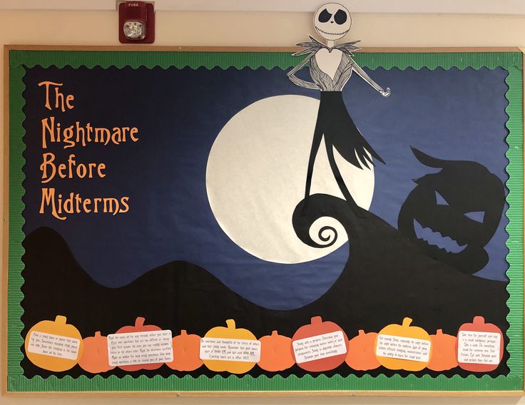 a bulletin board that has been decorated to look like a halloween scene