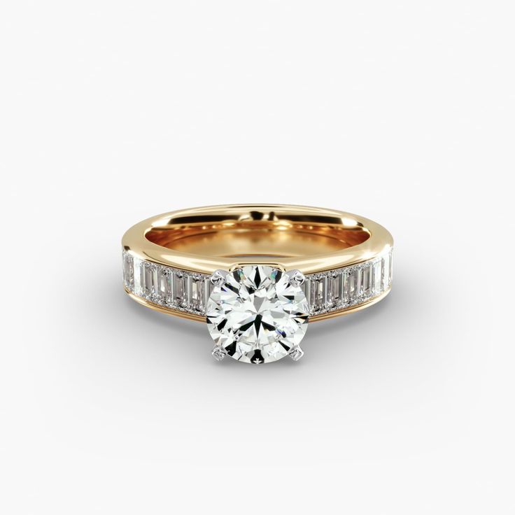 a yellow gold ring with baguets and channeled diamonds on the side, set in